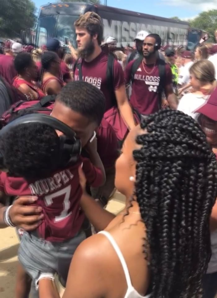 Marcus Murphy greets son, Mason, during a Dawg Walk last season. (Photo submitted by Alicia Cherry)